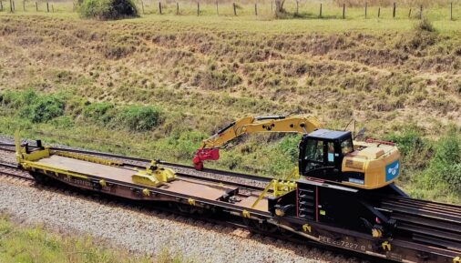 Flatcar by Super Metal for transporting excavators