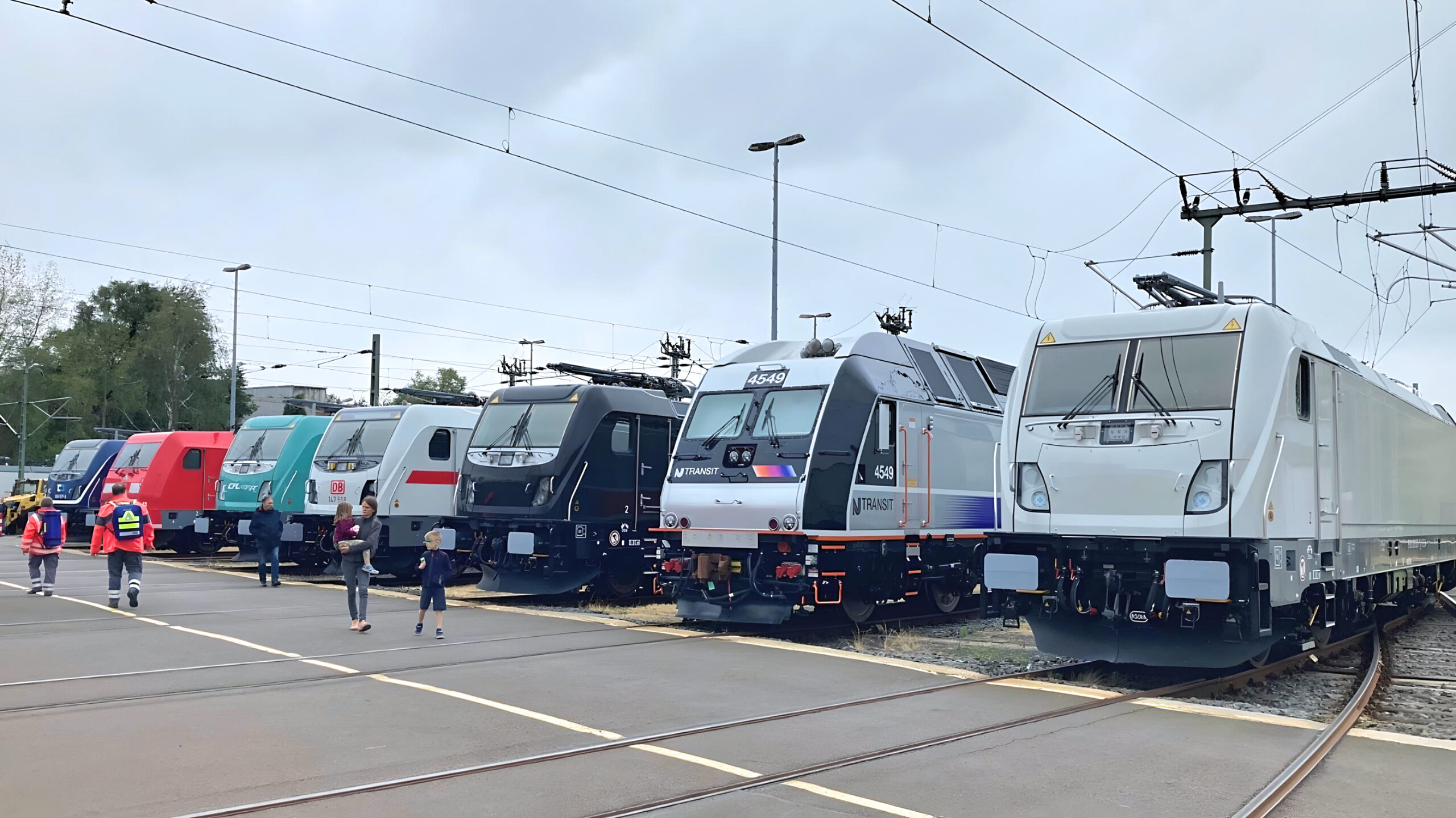 Alstom’s locomotive exhibition marking 175 years of locomotive manufacturing at Kassel, Germany, July 2023. Left to right: Traxx MS3 for ČD Cargo, Traxx AC2 for DB, Traxx MS3 for CFL Cargo, Traxx AC3 for DB, Traxx MS3 for TX Logistik, ALP-45DP for New Jersey Transit, and Traxx MS3 for Akiem