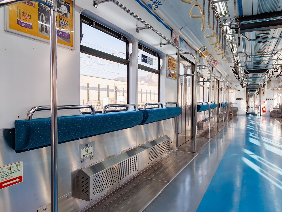 The converted Seoul seatless metro car with extra handrails